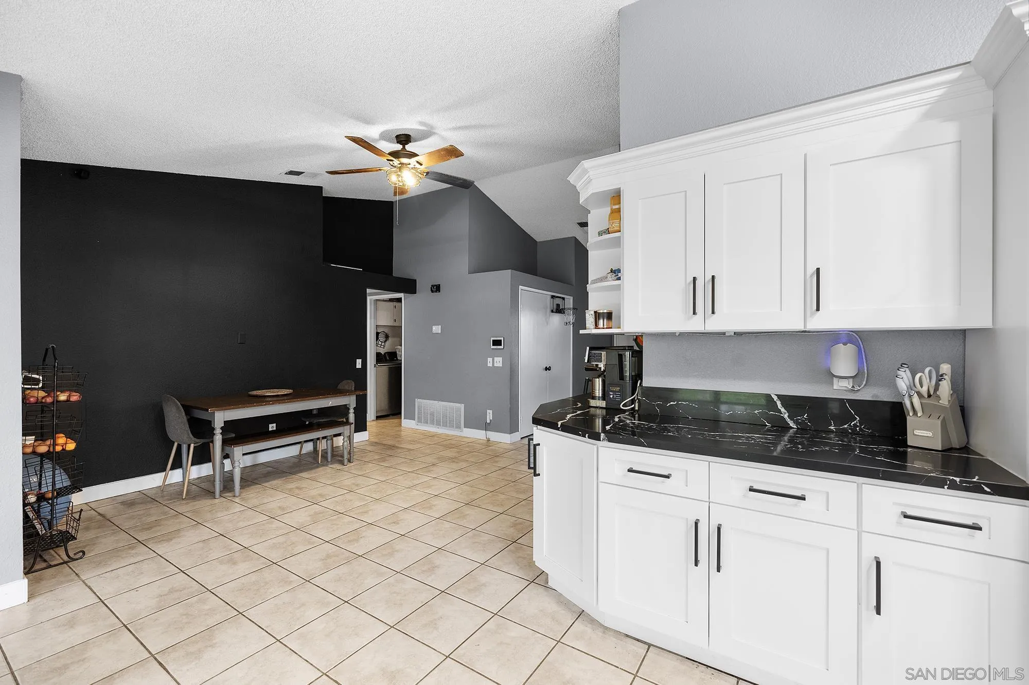 31297 Huron Street Temecula, CA 92592 - Photo 12 of 42 a kitchen with granite countertop a sink cabinets and stainless steel appliances