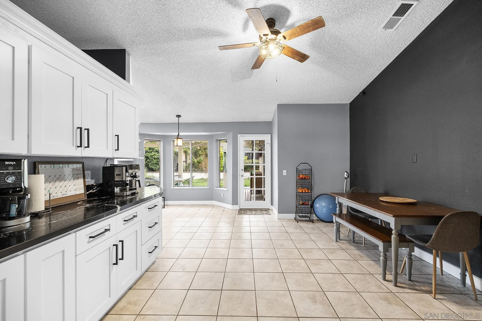 31297 Huron Street Temecula, CA 92592 - Photo 14 of 42 a large white kitchen with cabinets