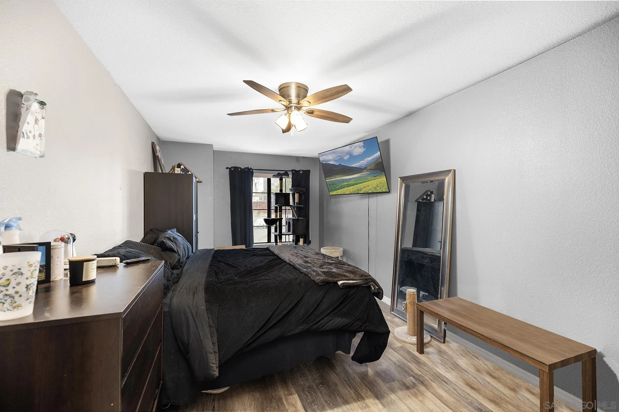 31297 Huron Street Temecula, CA 92592 - Photo 23 of 42 a bedroom with a bed and a chandelier