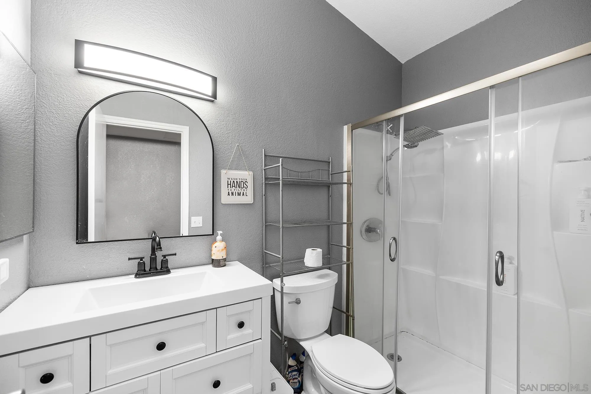 31297 Huron Street Temecula, CA 92592 - Photo 24 of 42 a bathroom with a toilet a sink and shower