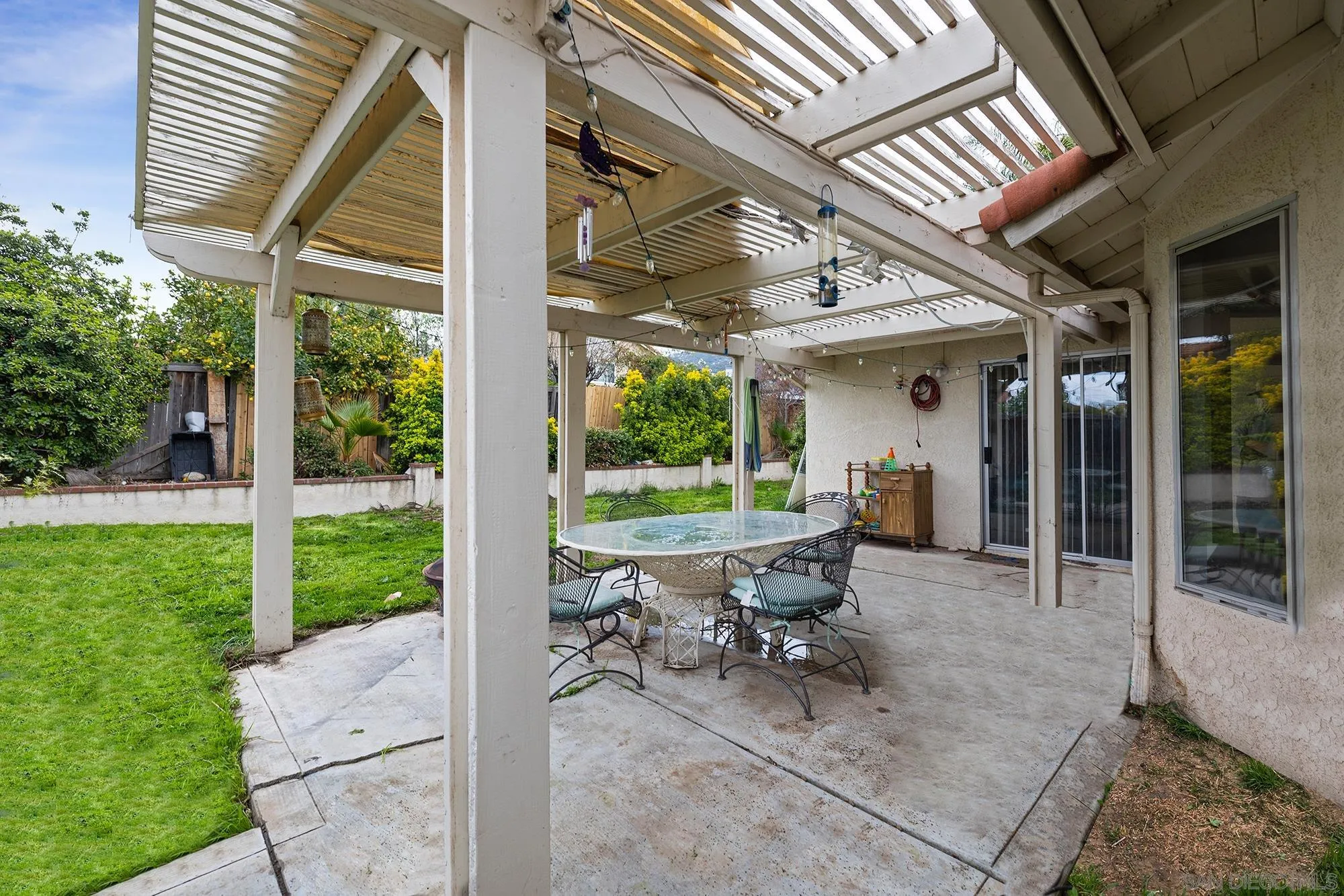 31297 Huron Street Temecula, CA 92592 - Photo 27 of 42 a view of a patio with table and chairs next to a yard