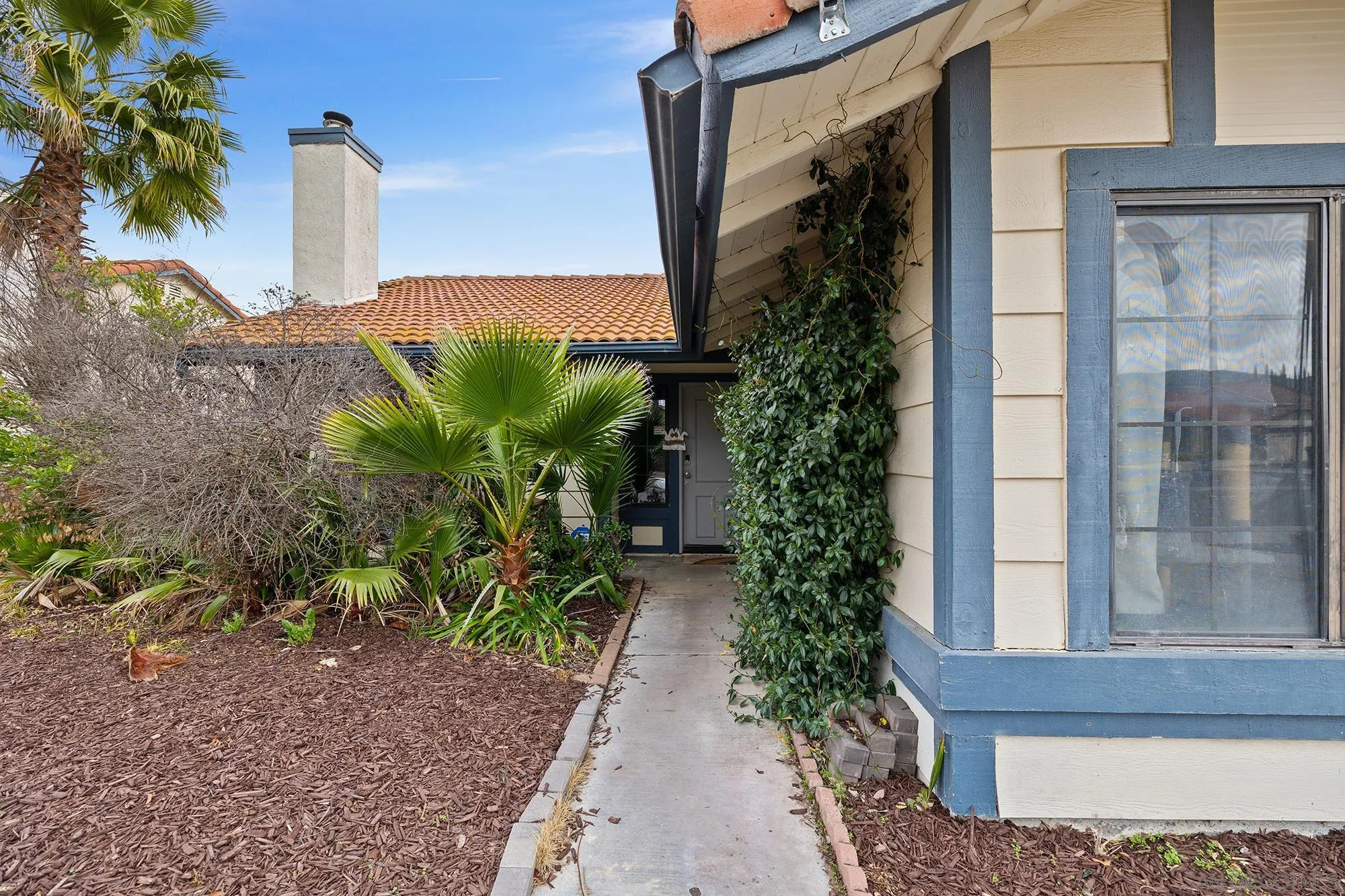 31297 Huron Street Temecula, CA 92592 - Photo 3 of 42 a house with a yard and plants