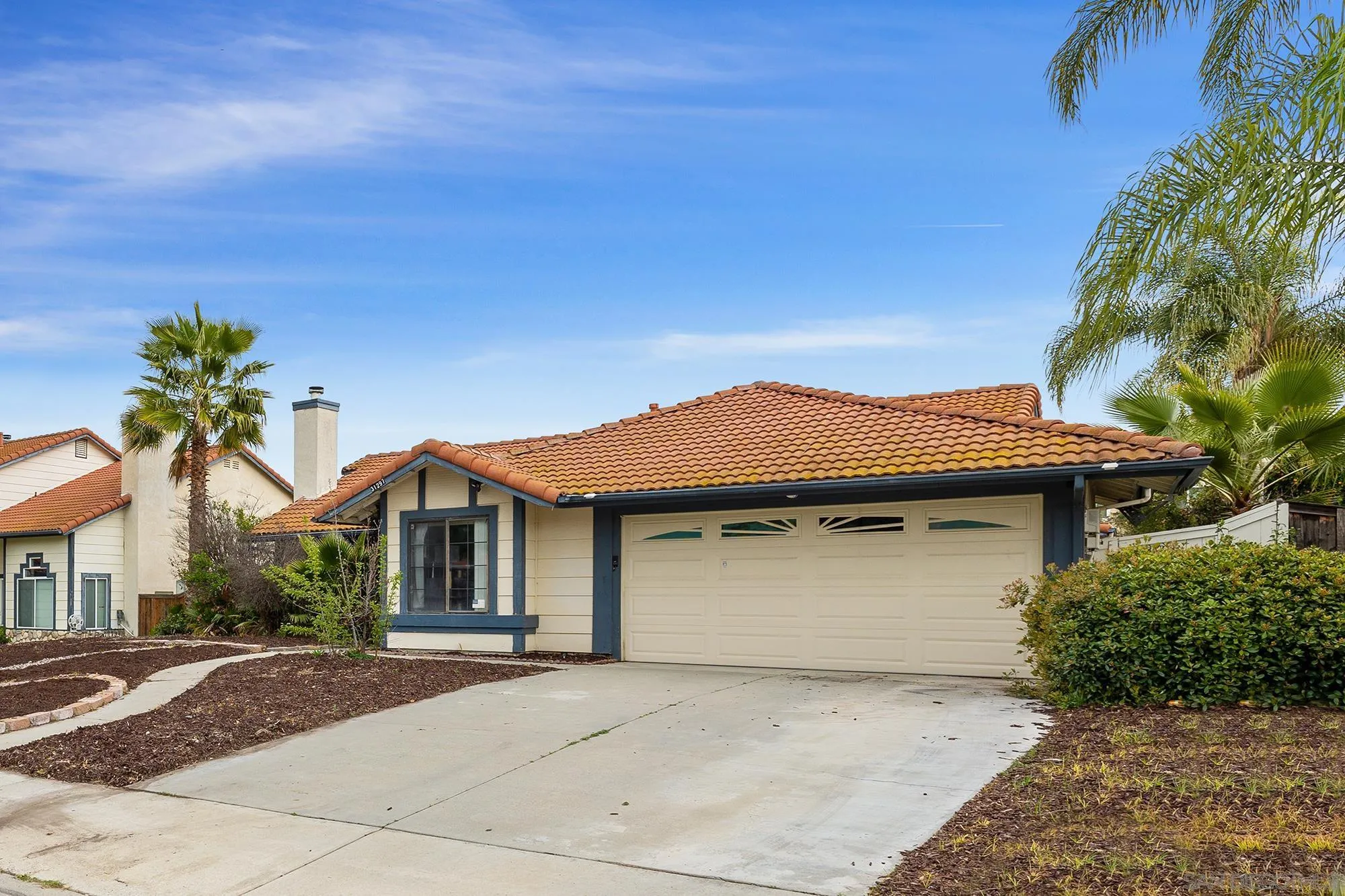 31297 Huron Street Temecula, CA 92592 - Photo 40 of 42 a front view of a house with a garden