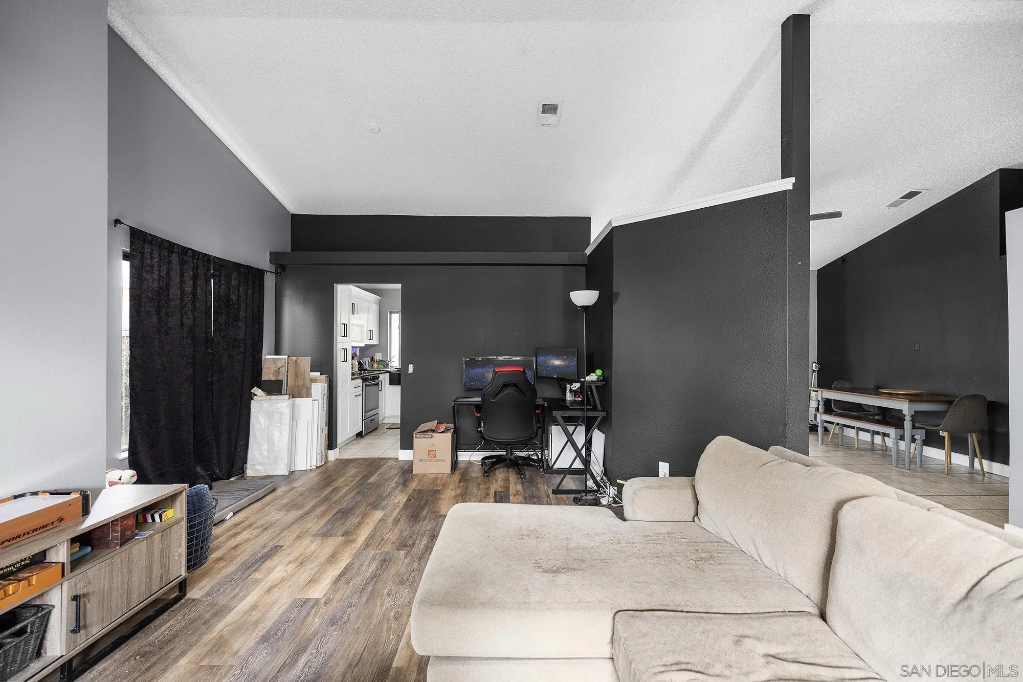 31297 Huron Street Temecula, CA 92592 - Photo 7 of 42 a living room with furniture and a flat screen tv