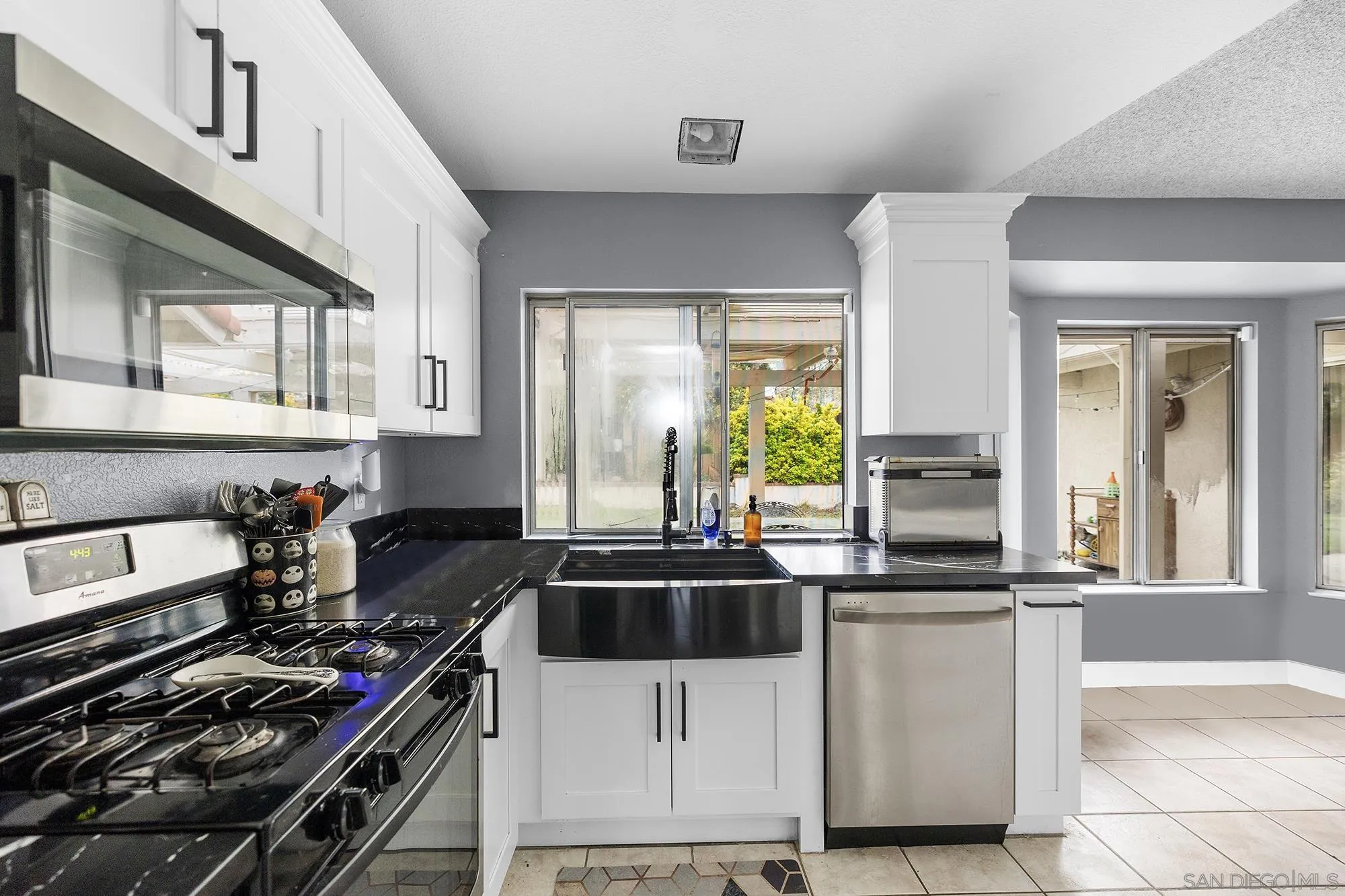 31297 Huron Street Temecula, CA 92592 - Photo 8 of 42 a kitchen with a sink a stove and cabinets