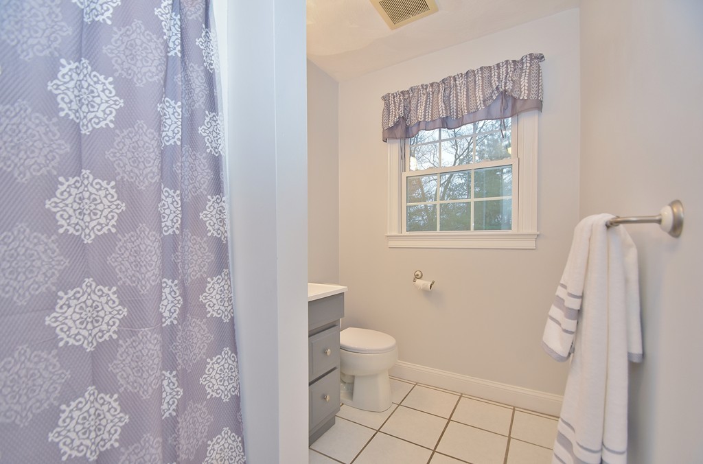48 Partridge Road Billerica, MA 01821 - Photo 11 of 19 a bathroom with a sink toilet and shower