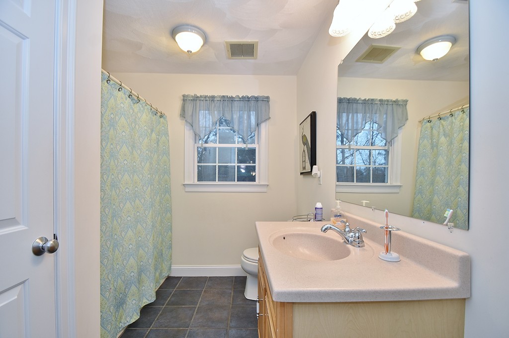 48 Partridge Road Billerica, MA 01821 - Photo 14 of 19 a bathroom with a sink and a mirror