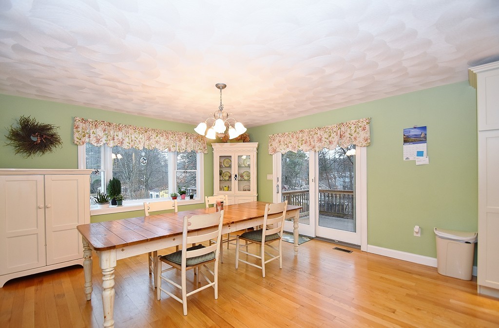 48 Partridge Road Billerica, MA 01821 - Photo 4 of 19 a view of a dining room with furniture wooden floor and chandelier
