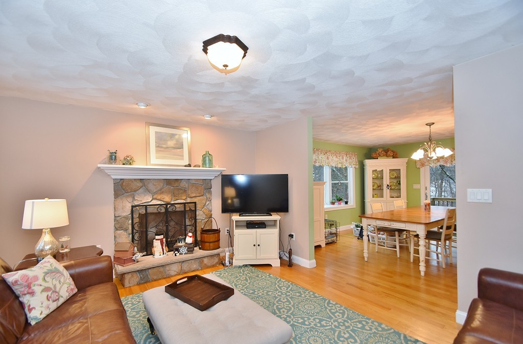48 Partridge Road Billerica, MA 01821 - Photo 6 of 19 a living room with furniture and a fireplace