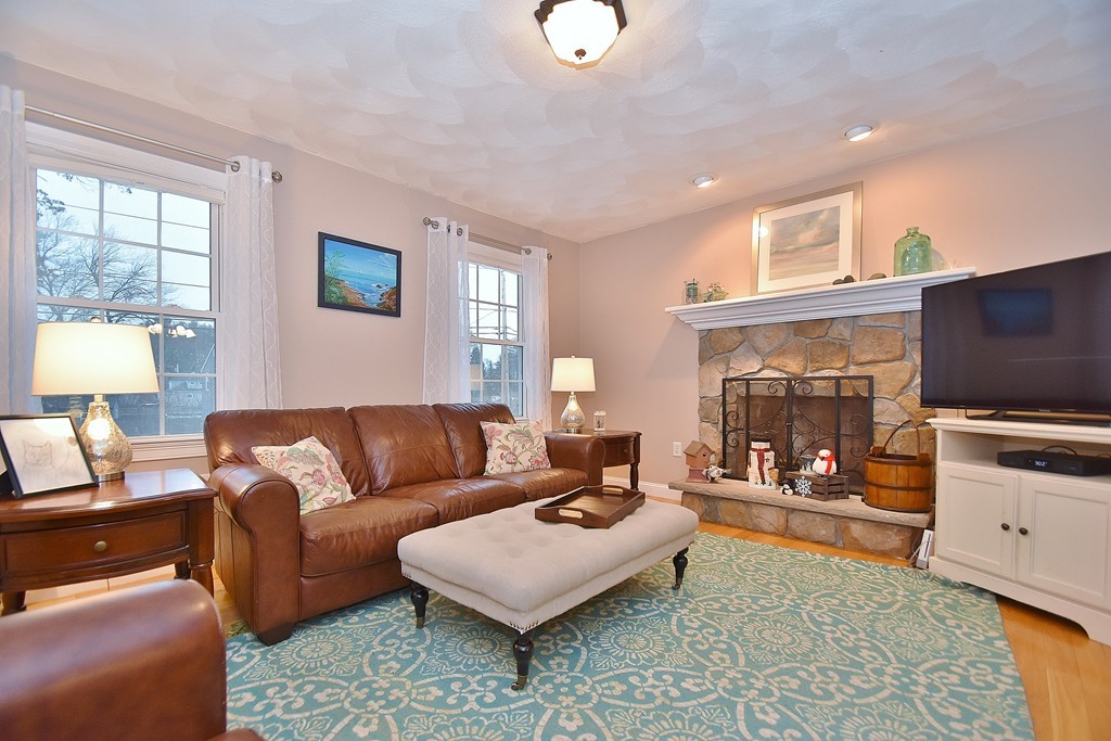 48 Partridge Road Billerica, MA 01821 - Photo 7 of 19 a living room with furniture and a flat screen tv