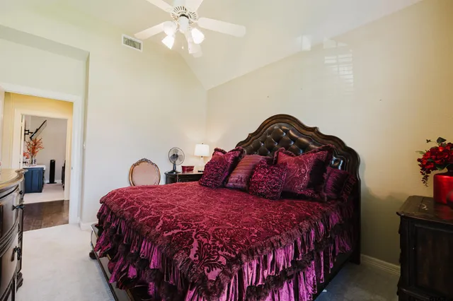 a bathroom with a granite countertop sink a toilet and a mirror