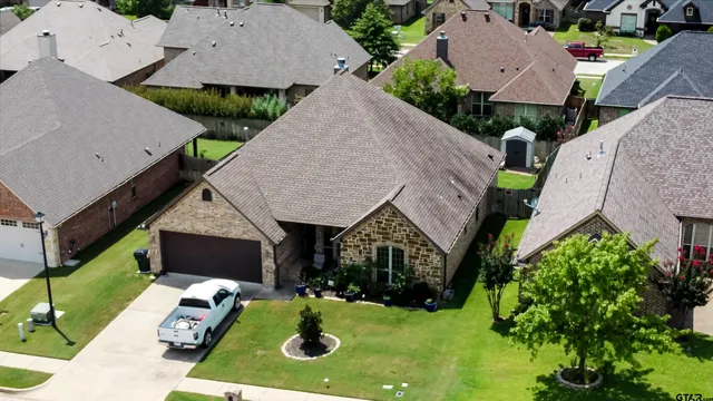 an aerial view of house with yard