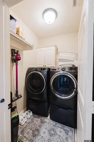 a view of a patio with table and chairs and potted plants