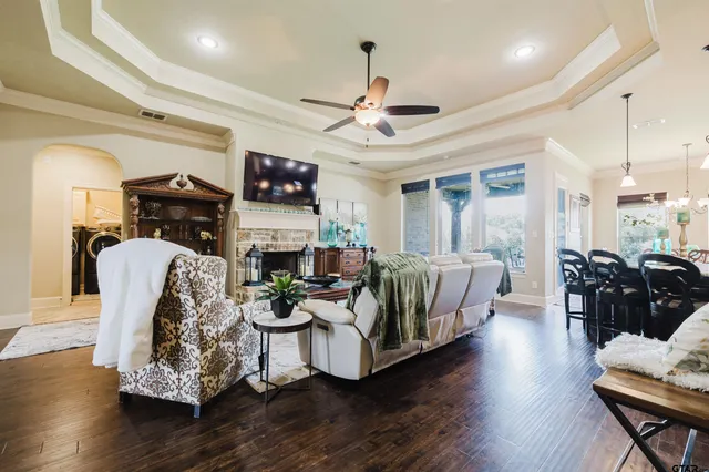 a living room with furniture fireplace and flat screen tv