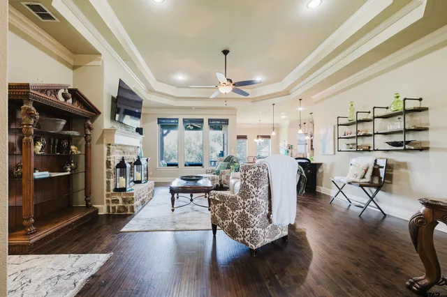 a living room with furniture and wooden floor