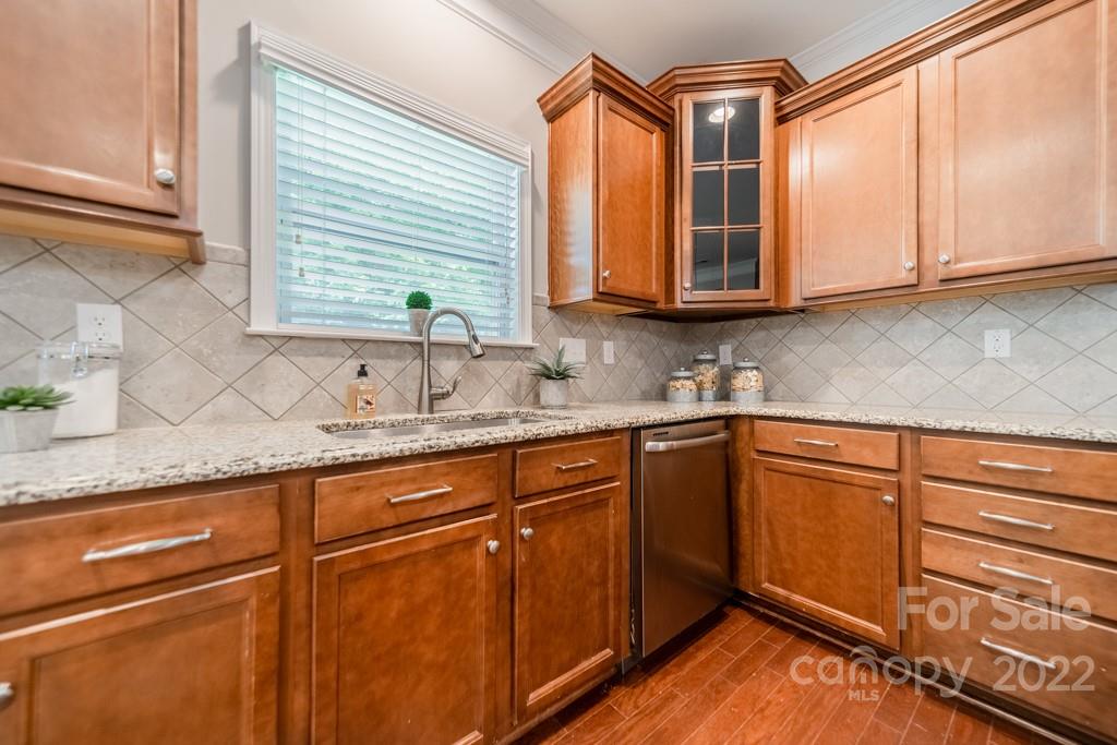 79109 Ridgehaven Road Lancaster, SC 29720 - Photo 12 of 48 a kitchen with granite countertop cabinets sink and window