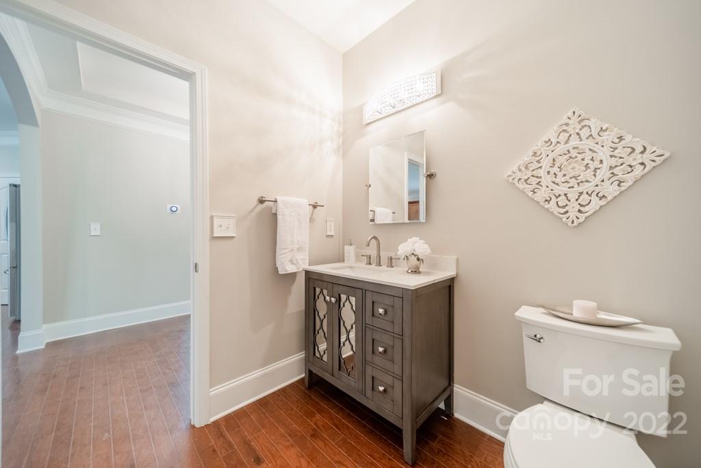 79109 Ridgehaven Road Lancaster, SC 29720 - Photo 25 of 48 a bathroom with a toilet a sink and mirror