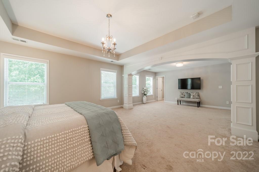 79109 Ridgehaven Road Lancaster, SC 29720 - Photo 28 of 48 a spacious bedroom with a bed and a flat screen tv