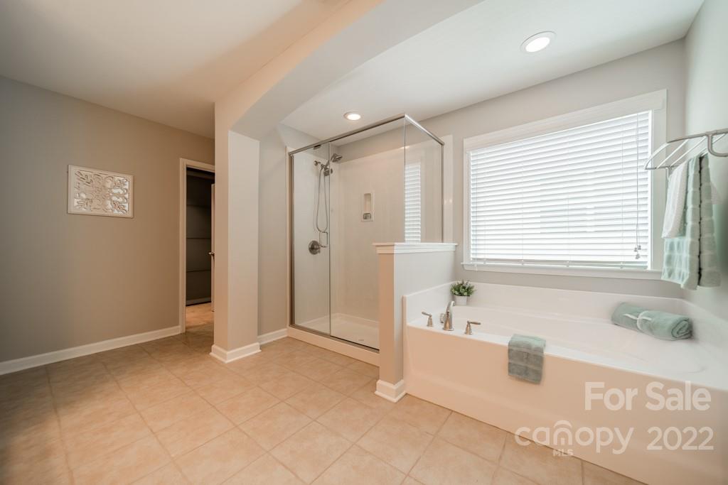 79109 Ridgehaven Road Lancaster, SC 29720 - Photo 30 of 48 a spacious bathroom with a tub shower and sink