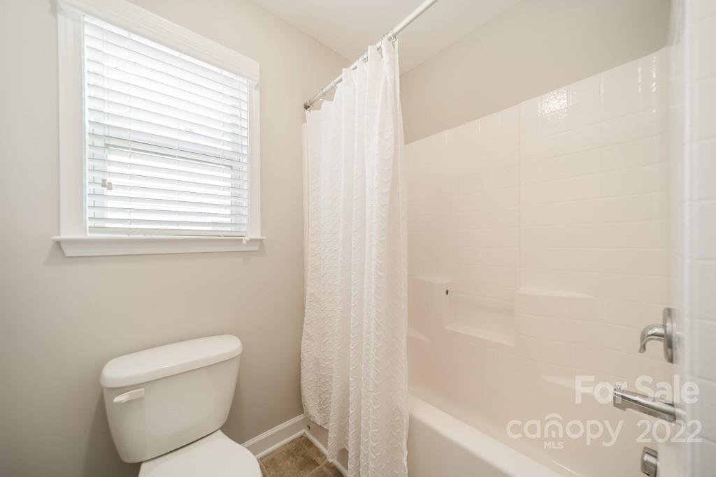 79109 Ridgehaven Road Lancaster, SC 29720 - Photo 36 of 48 a white toilet sitting next to a bath tub