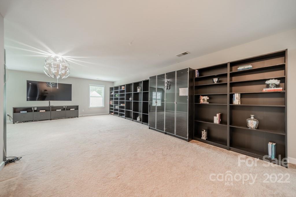 79109 Ridgehaven Road Lancaster, SC 29720 - Photo 37 of 48 a large bedroom with a bed and a television in it