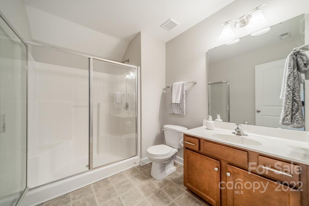 79109 Ridgehaven Road Lancaster, SC 29720 - Photo 41 of 48 a bathroom with a double vanity sink toilet and shower