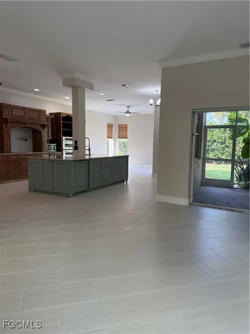 a view of a kitchen with furniture and a kitchen