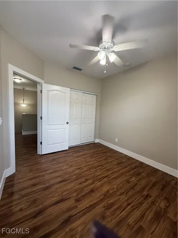 a bathroom with a toilet and shower