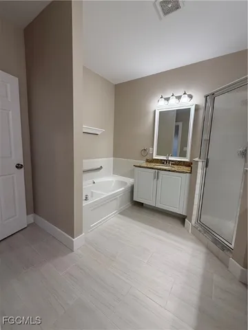 a view of cabinets and wooden floor