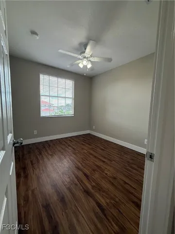 a large bathroom with a large mirror vanity and shower