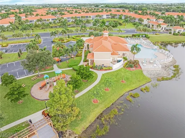 a view of a dining room with furniture and a large window