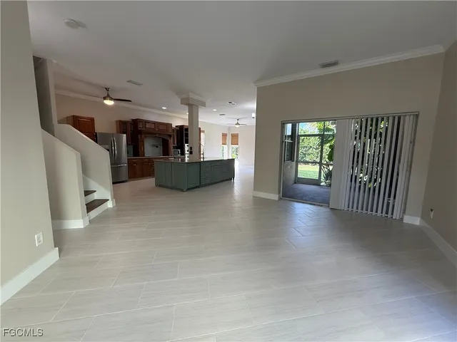 a view of a kitchen with furniture and a window