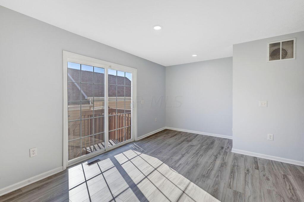 6345 Needletail Road, Unit 24634 Columbus, OH 43230 - Photo 13 of 58 • New luxury vinyl plank flooring ~ 2021 • Gray painted walls • Can lighting