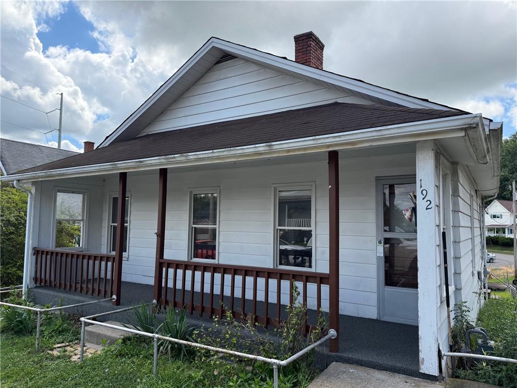 192 Elm Street Washington, PA 15301 - Photo 1 of 11 a front view of a house with a porch