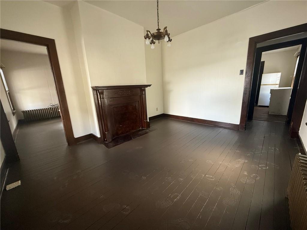 192 Elm Street Washington, PA 15301 - Photo 3 of 11 an empty room with wooden floor and a ceiling fan