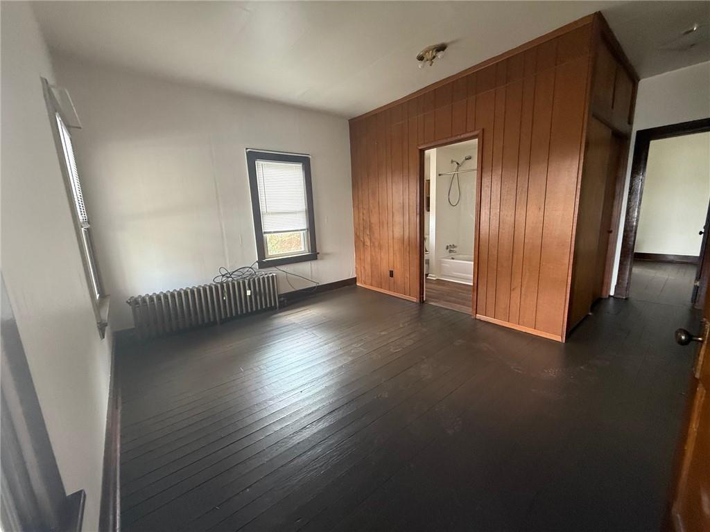 192 Elm Street Washington, PA 15301 - Photo 4 of 11 a view of an empty room with wooden floor and a window