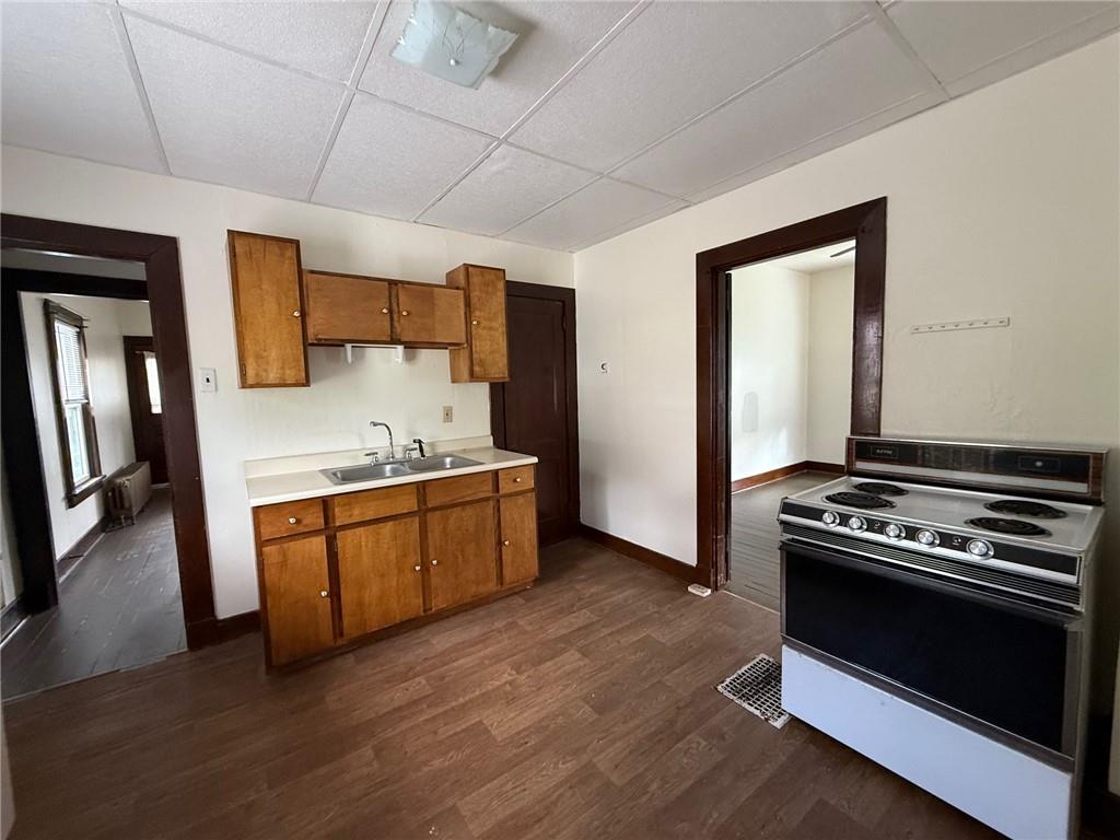 192 Elm Street Washington, PA 15301 - Photo 8 of 11 a kitchen with granite countertop a stove and a sink