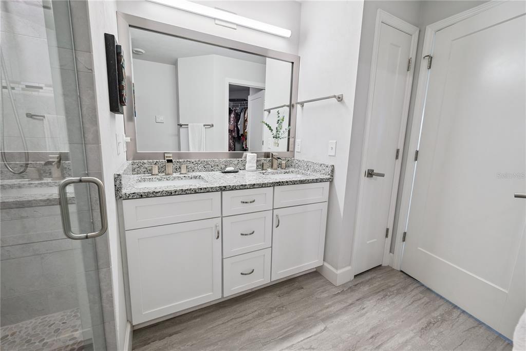 1790 Southwest 247th Street Newberry, FL 32669 - Photo 32 of 44 a spacious bathroom with a granite countertop sink mirror and double