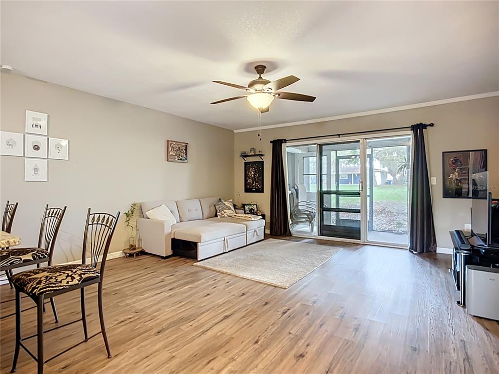 1304 Alfred Street, Unit A Brandon, FL 33510 - Photo 15 of 25 a living room with furniture and a wooden floor