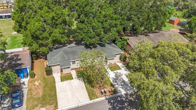 an aerial view of residential house with outdoor space