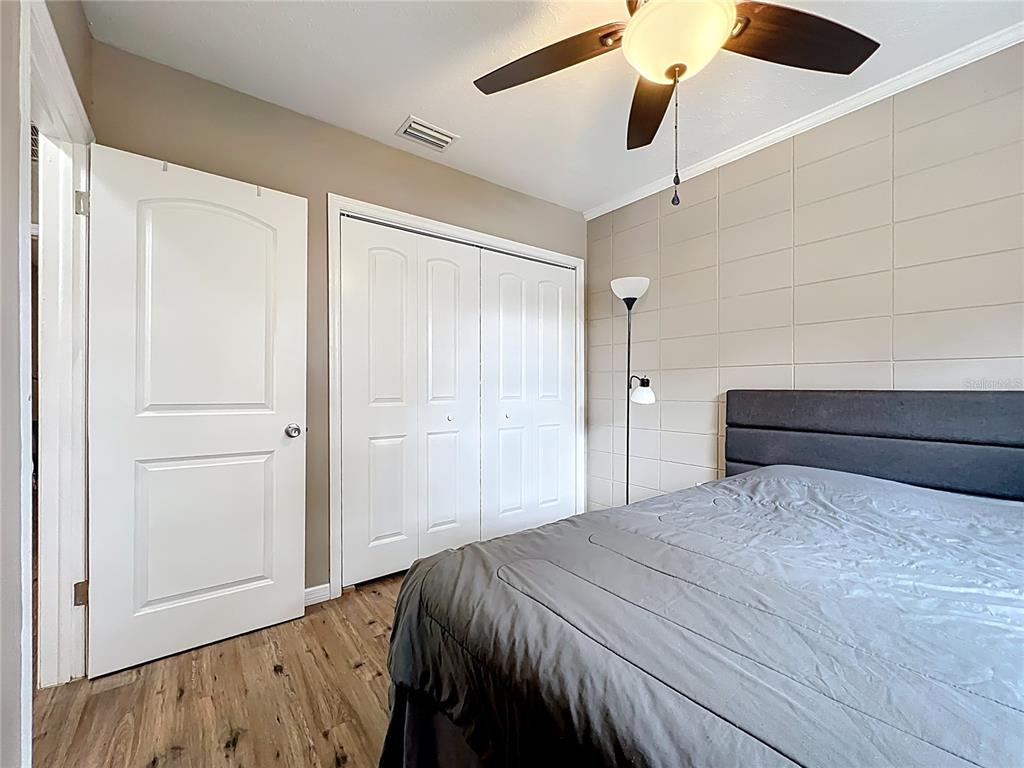 1304 Alfred Street, Unit A Brandon, FL 33510 - Photo 21 of 25 a bedroom with a bed and a walk in closet