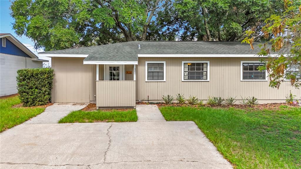 1304 Alfred Street, Unit A Brandon, FL 33510 - Photo 7 of 25 a front view of house with yard