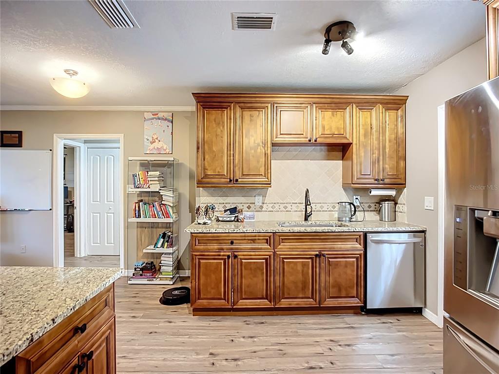 1304 Alfred Street, Unit A Brandon, FL 33510 - Photo 10 of 25 a kitchen with a sink cabinets and window