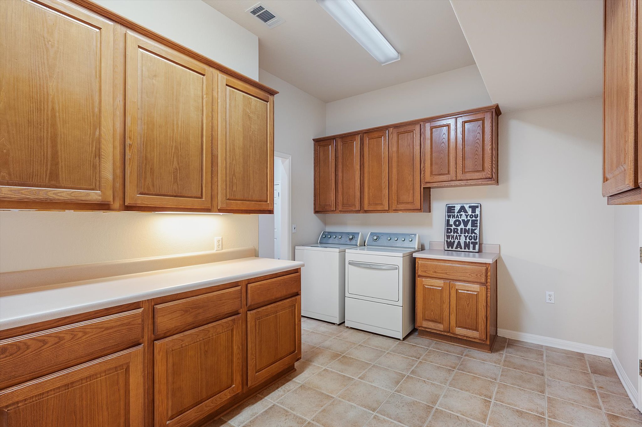 112 Goldenrod Way Georgetown, TX 78633 - Photo 28 of 40 Laundry room with hobby area
