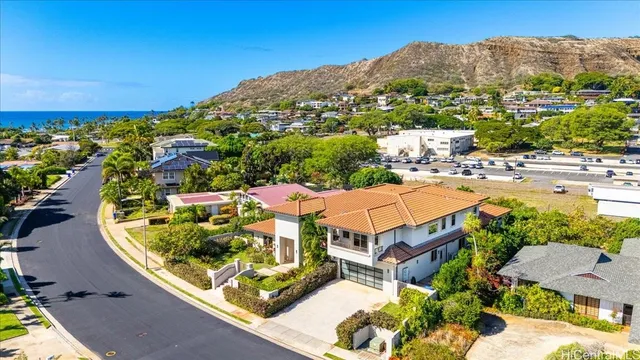 an aerial view of a house with a ocean view