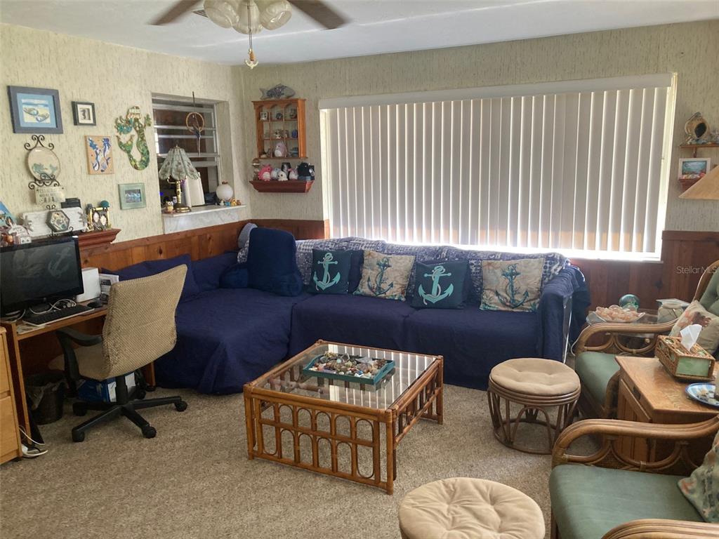 1126 Stevens Avenue DeLand, FL 32720 - Photo 12 of 38 a living room with furniture and wooden floor