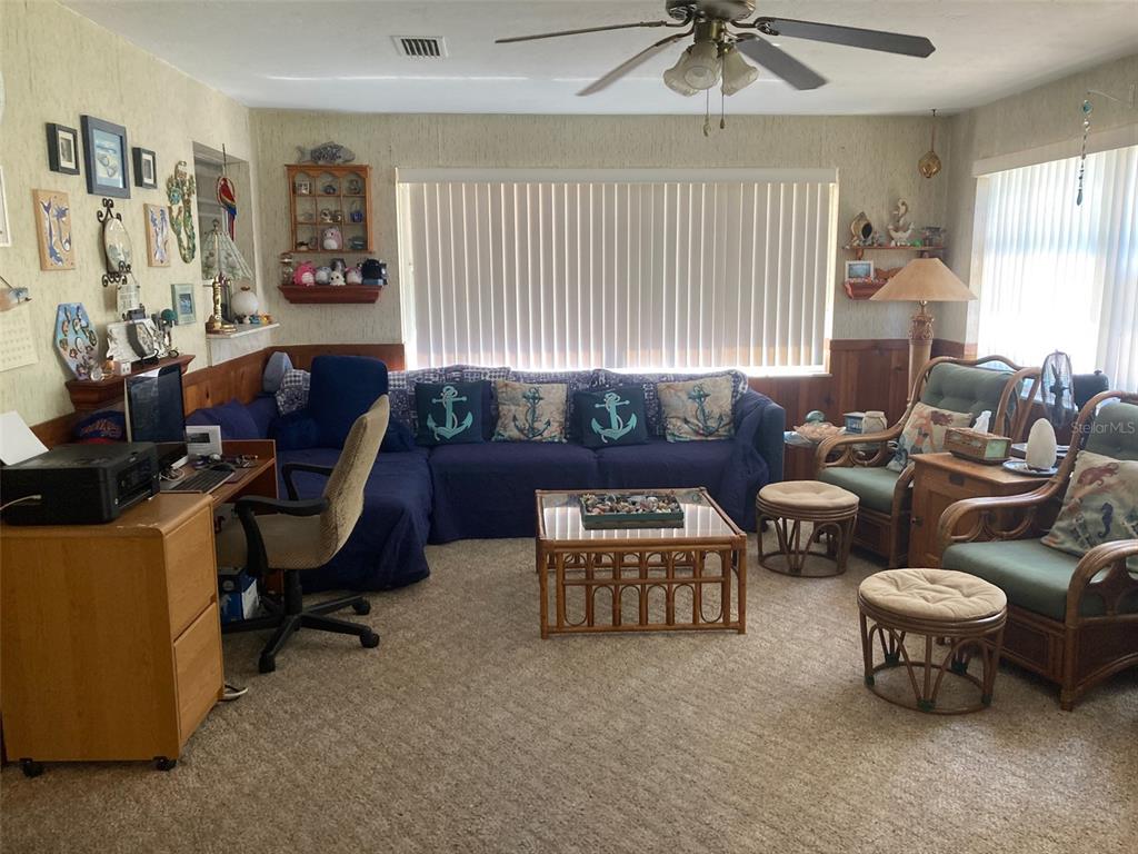 1126 Stevens Avenue DeLand, FL 32720 - Photo 13 of 38 a living room with furniture and a window