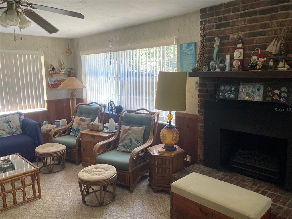 1126 Stevens Avenue DeLand, FL 32720 - Photo 14 of 38 a living room with furniture and a fireplace