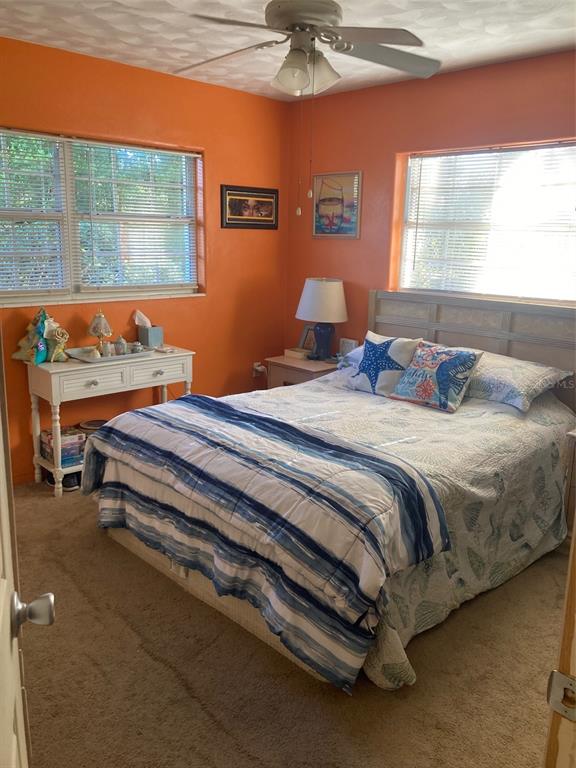 1126 Stevens Avenue DeLand, FL 32720 - Photo 16 of 38 a bedroom with a bed and window