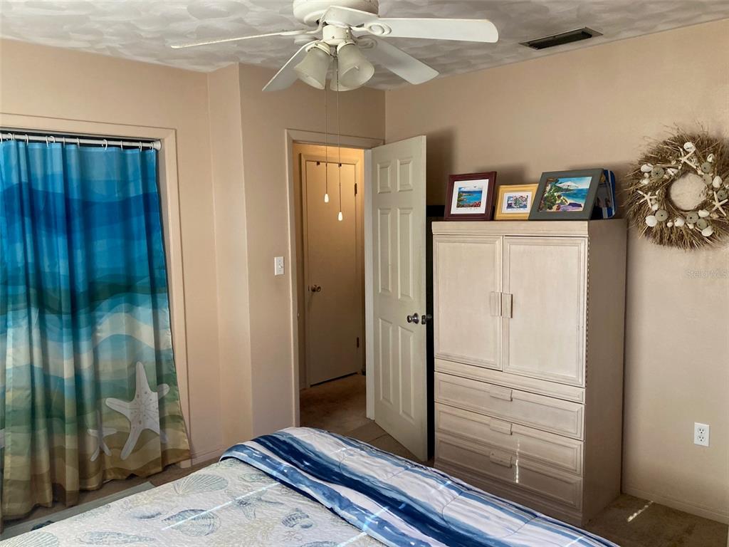 1126 Stevens Avenue DeLand, FL 32720 - Photo 17 of 38 a view of a hallway with closet and a mirror
